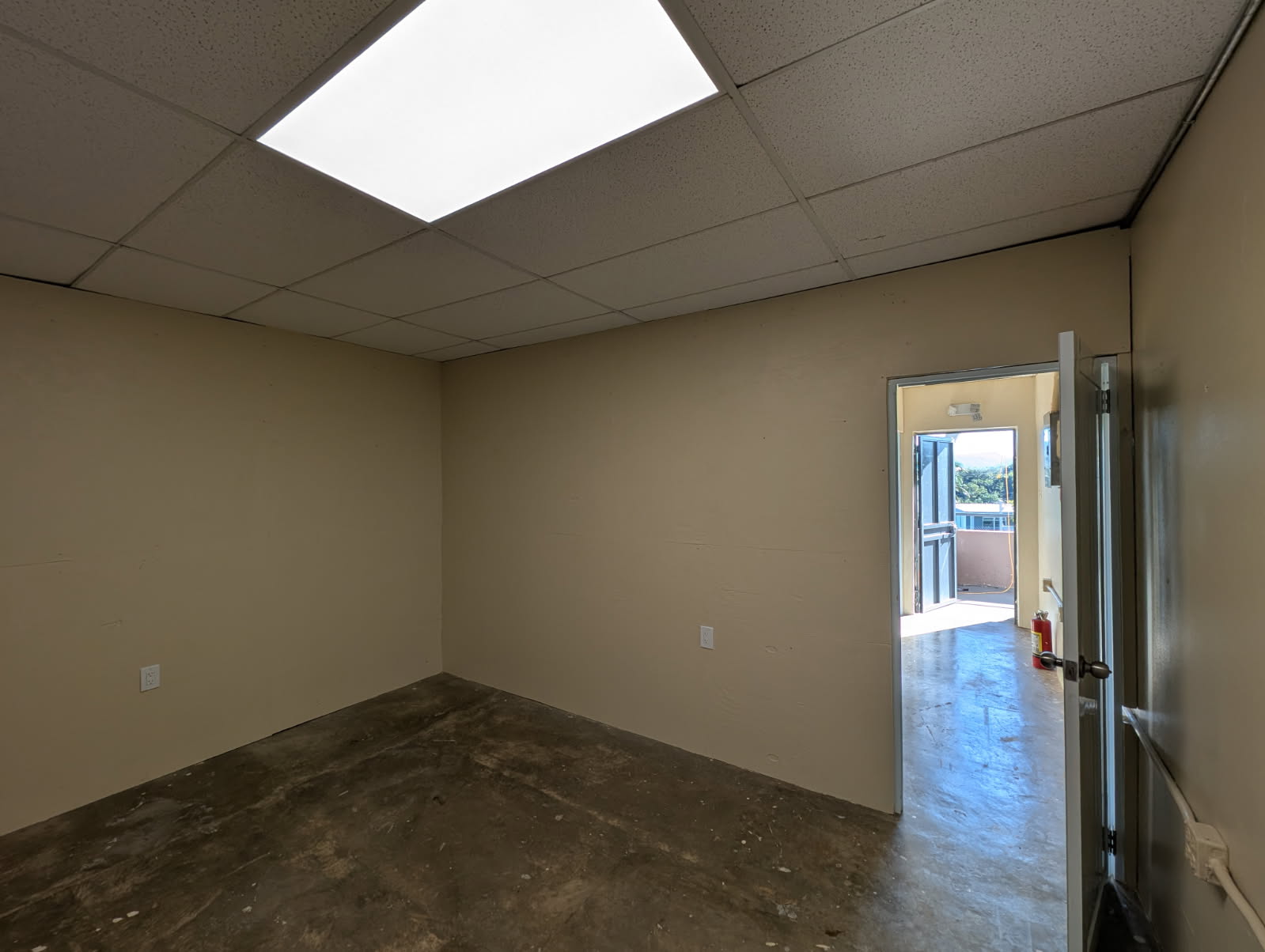 The inside of one of the four new rooms. It's painted, has a new ceiling and lights, and is ready for bunk beds.