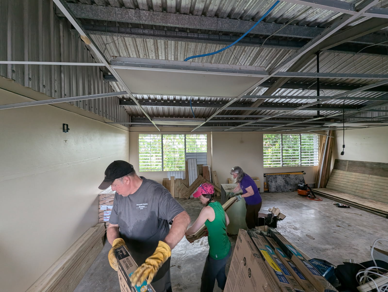 John Doornink, Tess Doornink and Val Williamson even had some time left over, once the rooms were done, to organize supplies in the next big room that needs to be divided (maybe next year!).