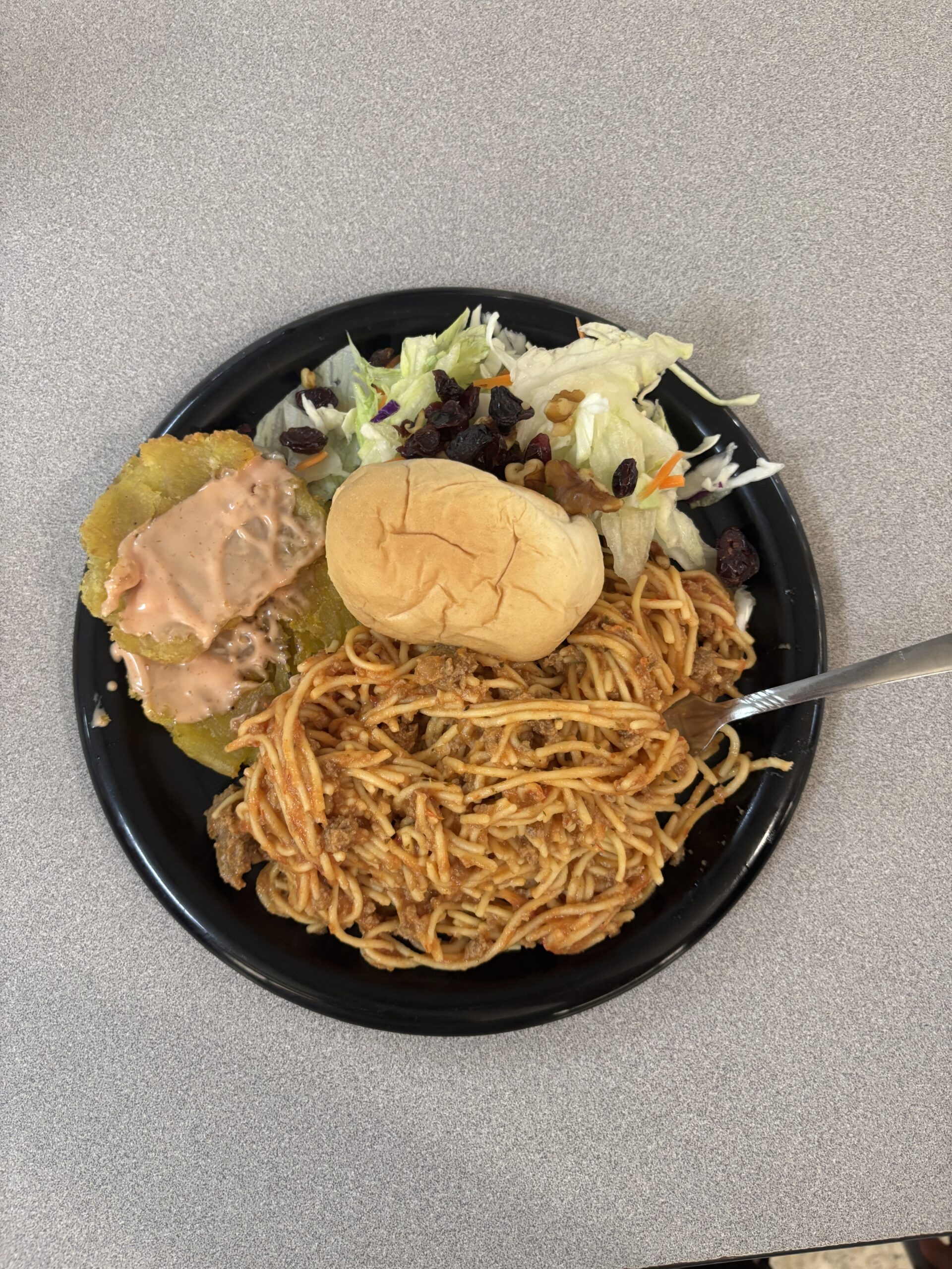 Our delicious dinner for the evening - spaghetti, salad, and hand-made tostones (mashed & twice-fried plantains).