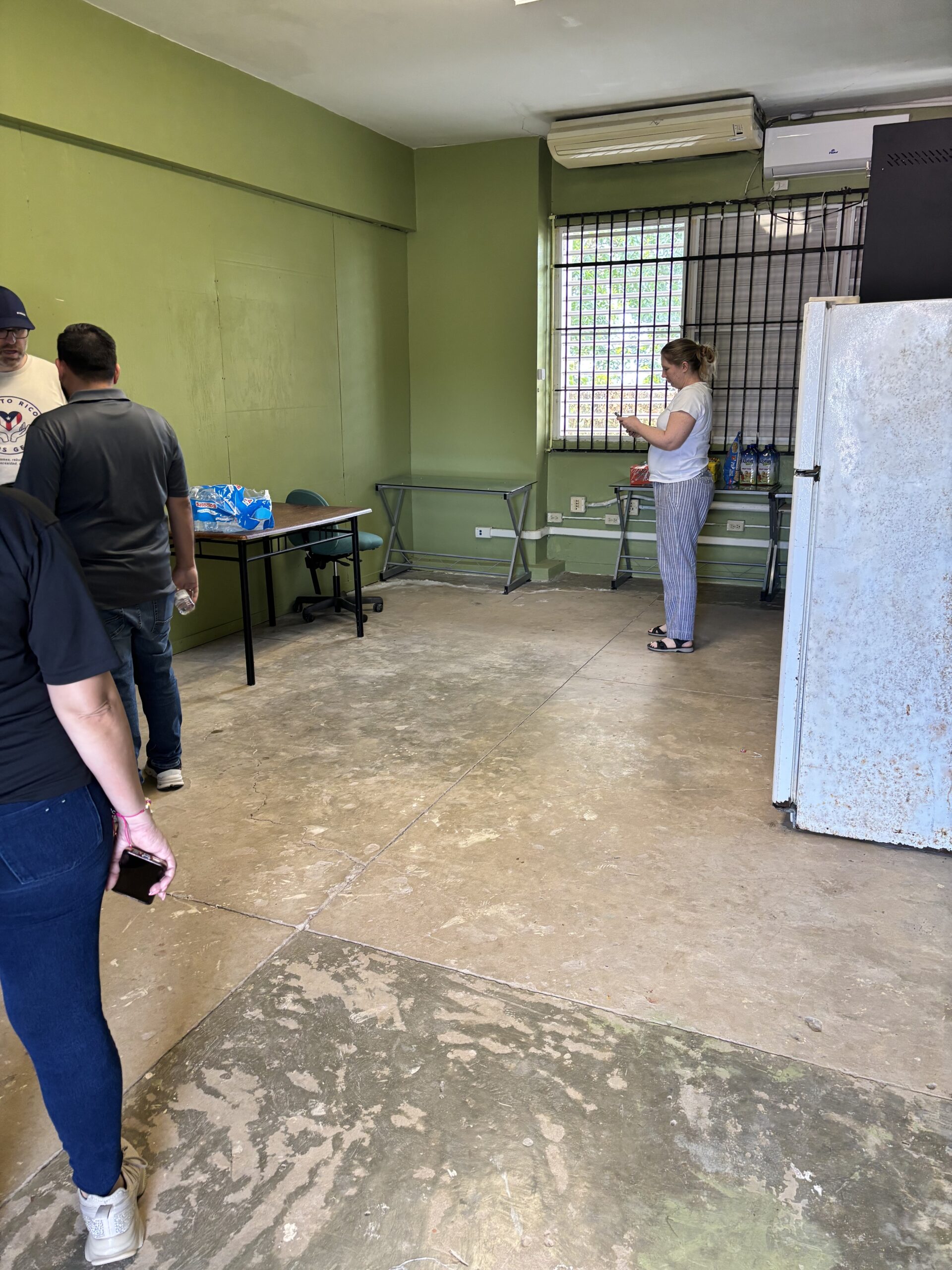 The "before" photo of the tech room - it needed new flooring, trim, paint & desks.