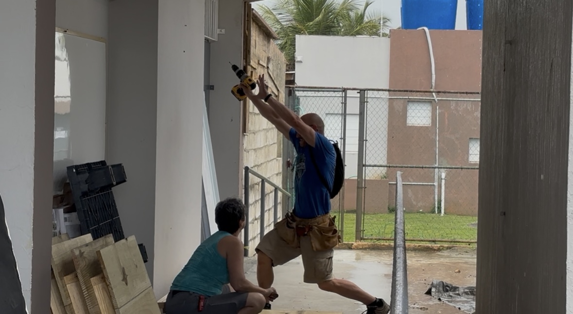 Joe Brooks posed with pride before he hammered the final nail into the tech desks.