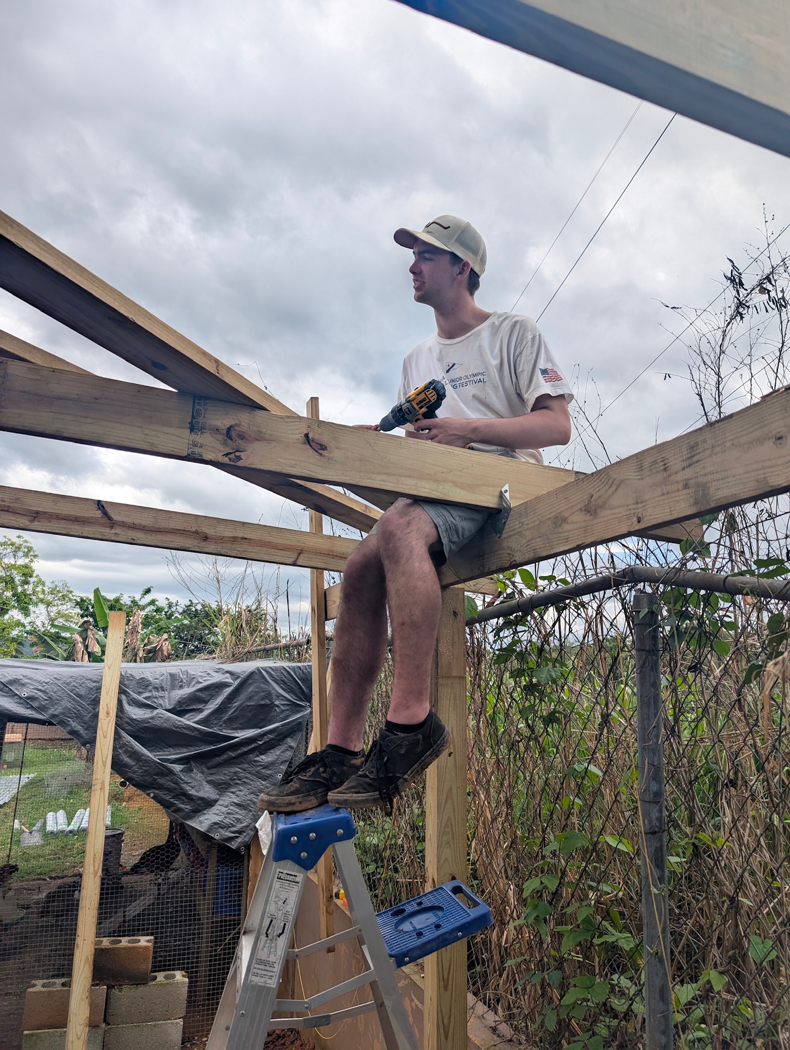 Elijah Dekker was our fearless roofer of the chicken coop today.