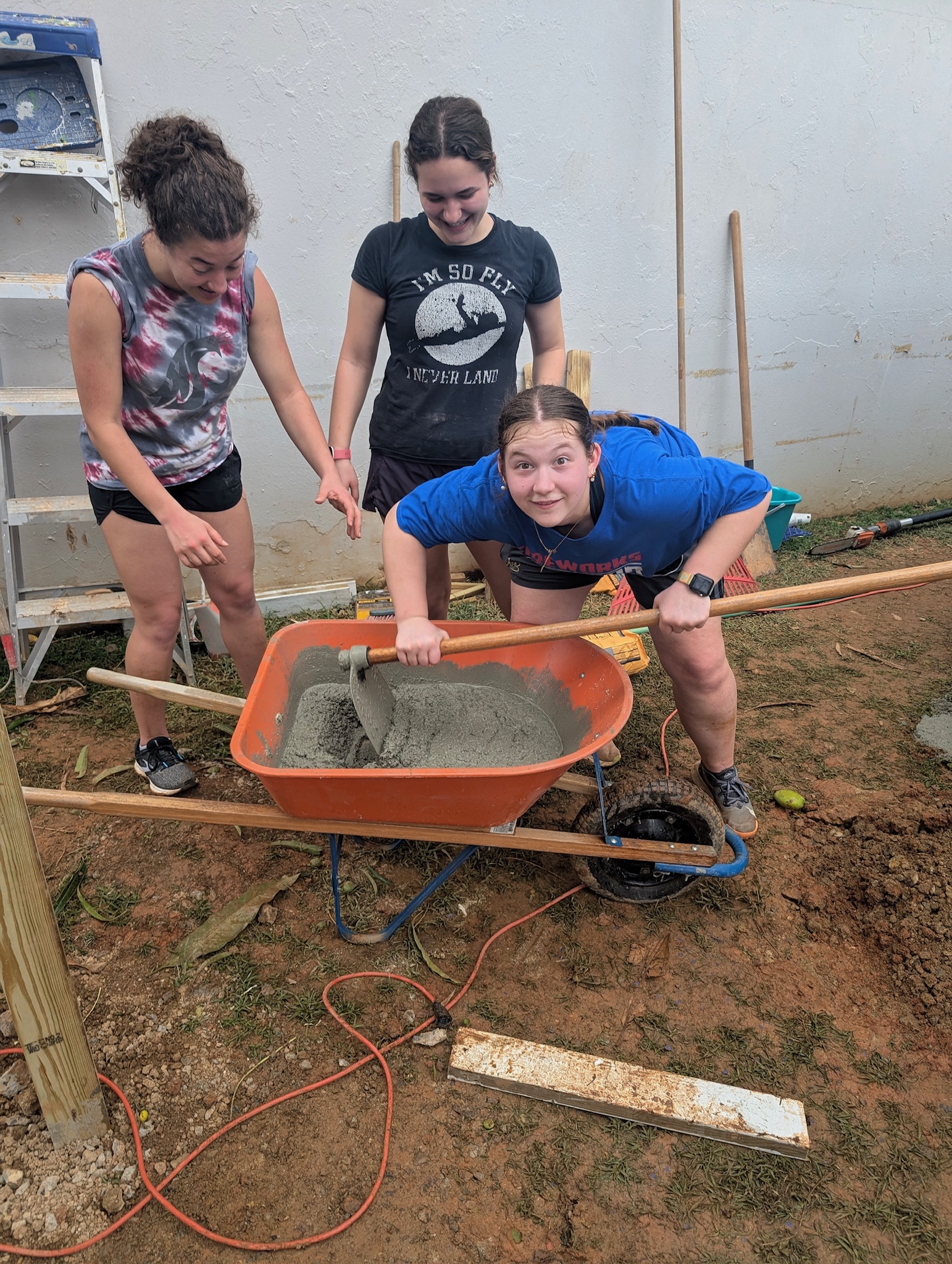 How many high school girls does it take to mix cement? Apparently three - 1 to do the work, and 2 to stand by and watch!